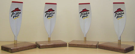 Hand carved model oars painted and signwritten for ‘Pizza Hut’
